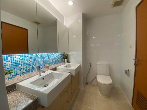 Contemporary bathroom with mosaic tiles and modern fixtures