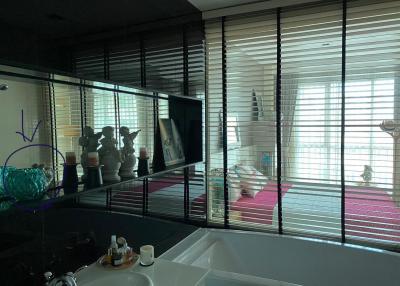 Contemporary bathroom with large mirror and window blinds