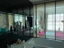 Contemporary bathroom with large mirror and window blinds