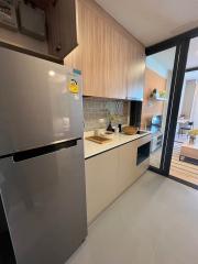 Modern kitchen with stainless steel appliances and wooden cabinetry