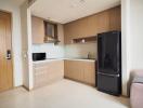 Modern kitchen with wooden cabinets and stainless steel appliances