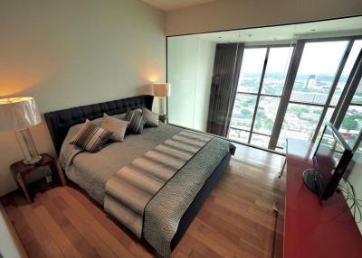 Modern bedroom with a view and hardwood floors