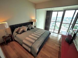 Modern bedroom with a view and hardwood floors