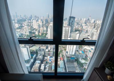 High-rise apartment view overlooking the city through large windows