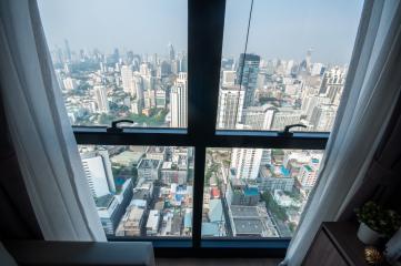 High-rise apartment view overlooking the city through large windows