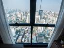 High-rise apartment view overlooking the city through large windows