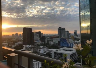 Stunning city skyline view at sunset from high-rise apartment balcony