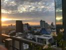 Stunning city skyline view at sunset from high-rise apartment balcony