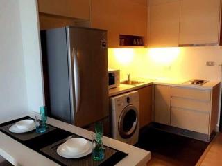 Modern kitchen with stainless steel appliances and dining area