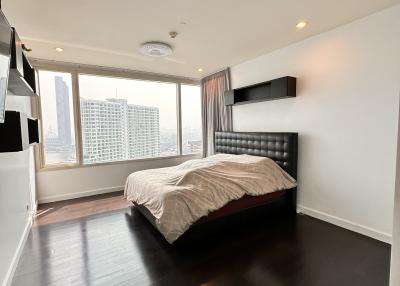 Spacious bedroom with modern design and city view