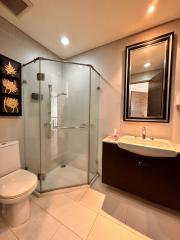 Modern bathroom interior with glass shower and vanity