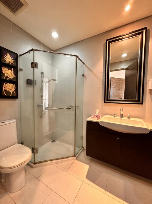 Modern bathroom interior with glass shower and vanity