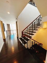 Modern building interior with staircase and hardwood floors