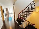 Modern building interior with staircase and hardwood floors