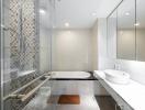 Modern bathroom interior with glass shower and white basin