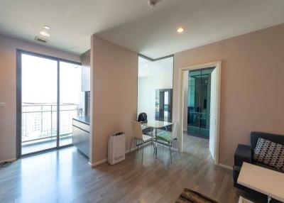 Modern living room with sliding glass door and minimalist furniture