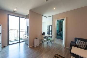 Modern living room with sliding glass door and minimalist furniture