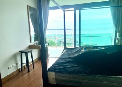 Ocean view bedroom with large windows