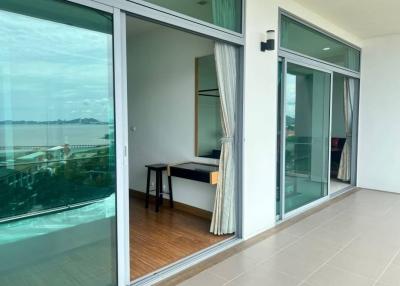 Spacious balcony with glass doors and sea view