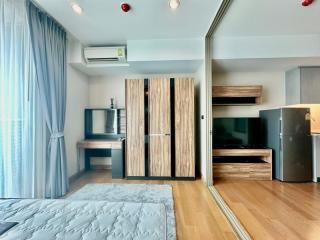 Modern bedroom interior with wooden wardrobe and entertainment unit