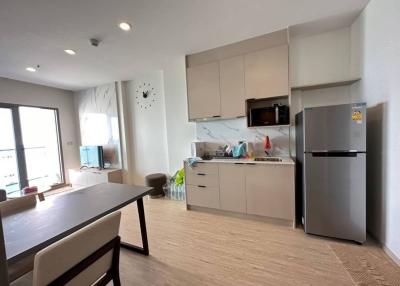 Modern kitchen with stainless steel appliances and a minimalist design