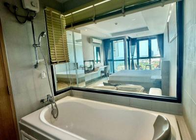 Modern bathroom with large bathtub and window view