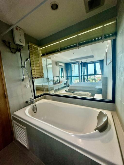 Modern bathroom with large bathtub and window view