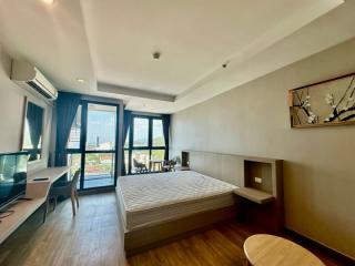 Modern bedroom with natural light and city view