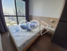 Compact bedroom with city view and natural lighting