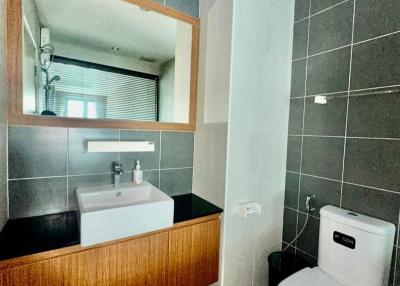 Modern bathroom with wall-mounted sink and toilet