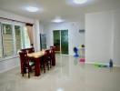 Bright and spacious living room with dining area