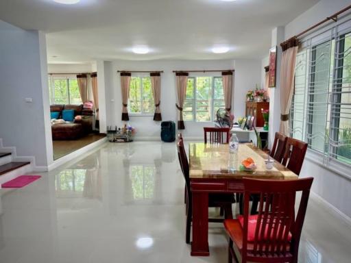 Spacious dining area with large windows and ample natural light