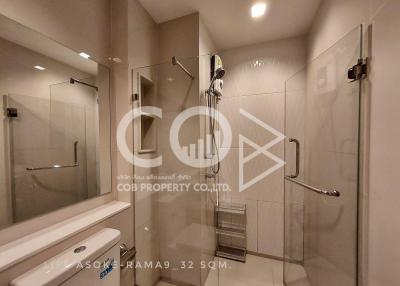 Modern bathroom interior with glass shower and vanity