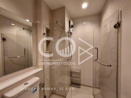 Modern bathroom interior with glass shower and vanity