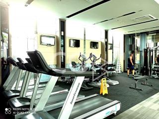 Modern gym facility inside residential building with various exercise equipment