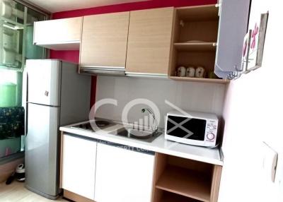 Compact and bright kitchen with open cabinets and modern appliances