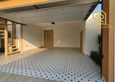 Modern home garage with tiled flooring and large space