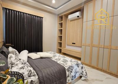 Cozy modern bedroom with built-in wardrobes and elegant decor