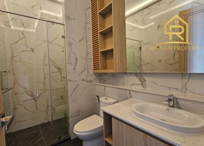 Modern bathroom with marble tiles and elegant fixtures
