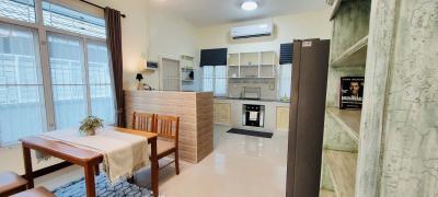 Modern kitchen with dining area and open-plan layout