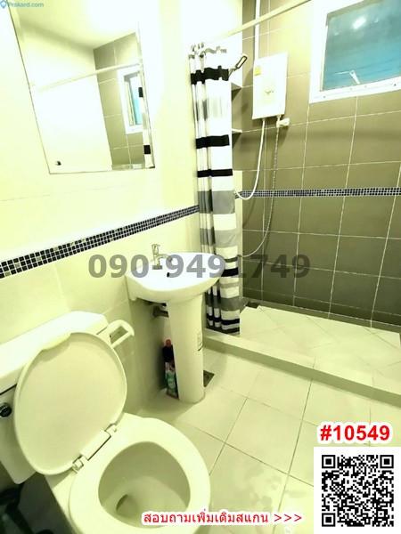 Compact bathroom with modern amenities and tiled walls