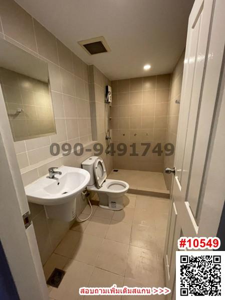 Modern bathroom with toilet and sink in a well-lit space