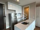 Modern kitchen with stainless steel appliances and white cabinetry