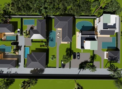 Aerial view of a luxury residential property with multiple buildings and swimming pools