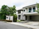 Modern residential home facade with lush greenery