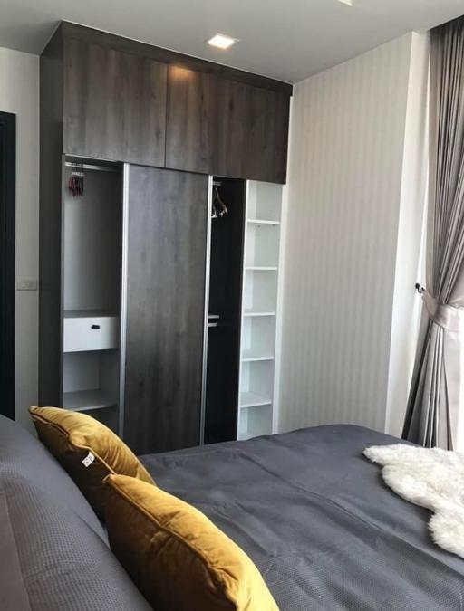 Cozy bedroom with king-sized bed and built-in wardrobe