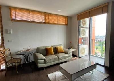 Modern living room with natural light and balcony access