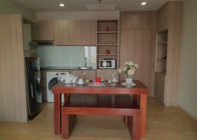 Modern kitchen with dining area and wooden finishes