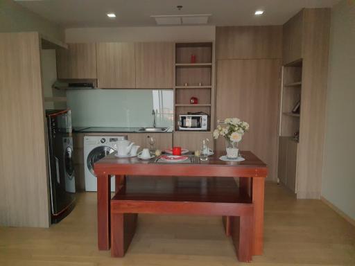 Modern kitchen with dining area and wooden finishes