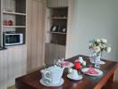 Modern kitchen interior with a wooden dining table set